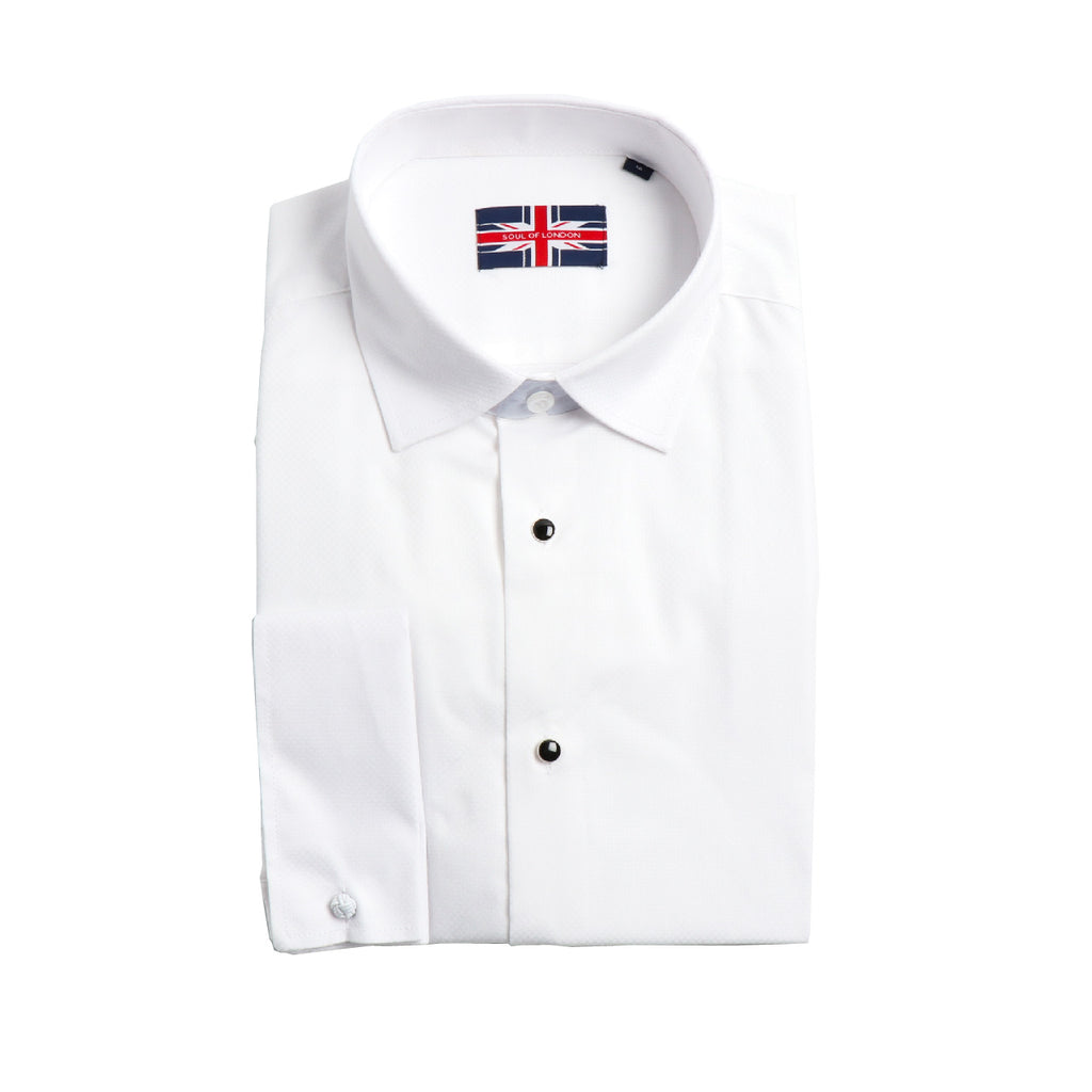 This white non-pleated textured tuxedo shirt is crafted from100% cotton for a luxe feel. Its slim fit is complemented by a French Cuff and the removable black stud buttons elevate the look. With no pocket, this shirt is perfect for formal events.