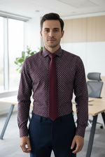 Load image into Gallery viewer, Our model is wearing a burgundy geometric patterned shirt and tie in an office setting
