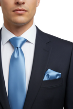 Load image into Gallery viewer, Man wearing a navy suit with a light blue tie and pocket square. 
