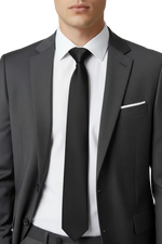 Load image into Gallery viewer,  Classic yet modern and stylish look .   A young Man wearing a black suit with a black tie, white shirt and white pocket square.
