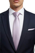 Load image into Gallery viewer, Man wearing a navy suit with a crisp white shirt, Blush Tie and pocket square.
