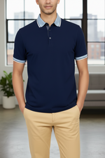 Load image into Gallery viewer, A navy blue slim fit pique polo with a spread collar and 3-button closure, displayed on a male model against a white background.
