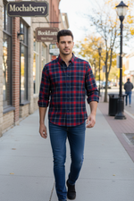 Load image into Gallery viewer, Man wearing a red and blue plaid cotton flannel shirt with dark blue jeans
