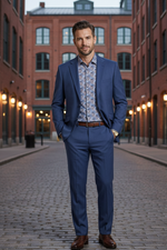 Load image into Gallery viewer, Our Model is wearing our Royal Blue stretch 2-Piece suit with 2 button closure and notched lapels. the pants are plain front with 2 pockets and 2 buttoned down pockets at the rear. 
