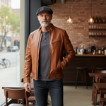 Charger l'image dans la galerie, our model is wearing our premium  cognac leather jacket for men crafted from genuine sheepskin. Features full-length front zip for versatile layering and functional pockets. This timeless men's leather jacket combines sophisticated style with rugged appeal—perfect for casual or dressed-up occasions. A classic wardrobe essential that delivers durability and refined edge.
