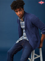 Charger l'image dans la galerie, Our model is showcasing a stylish Indigo Blue  knit shawl-collar cardigan, paired perfectly with a classic white T-shirt and blue jeans. This versatile outfit is ideal for any season, offering both comfort and sophistication. Elevate your wardrobe with this trendy look that's perfect for casual outings, office wear, or relaxed weekends. Whether you're dressing up or keeping it simple, it's a  Great look for any time of the year.
